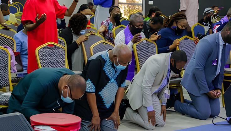 Hands raised in worship during a service